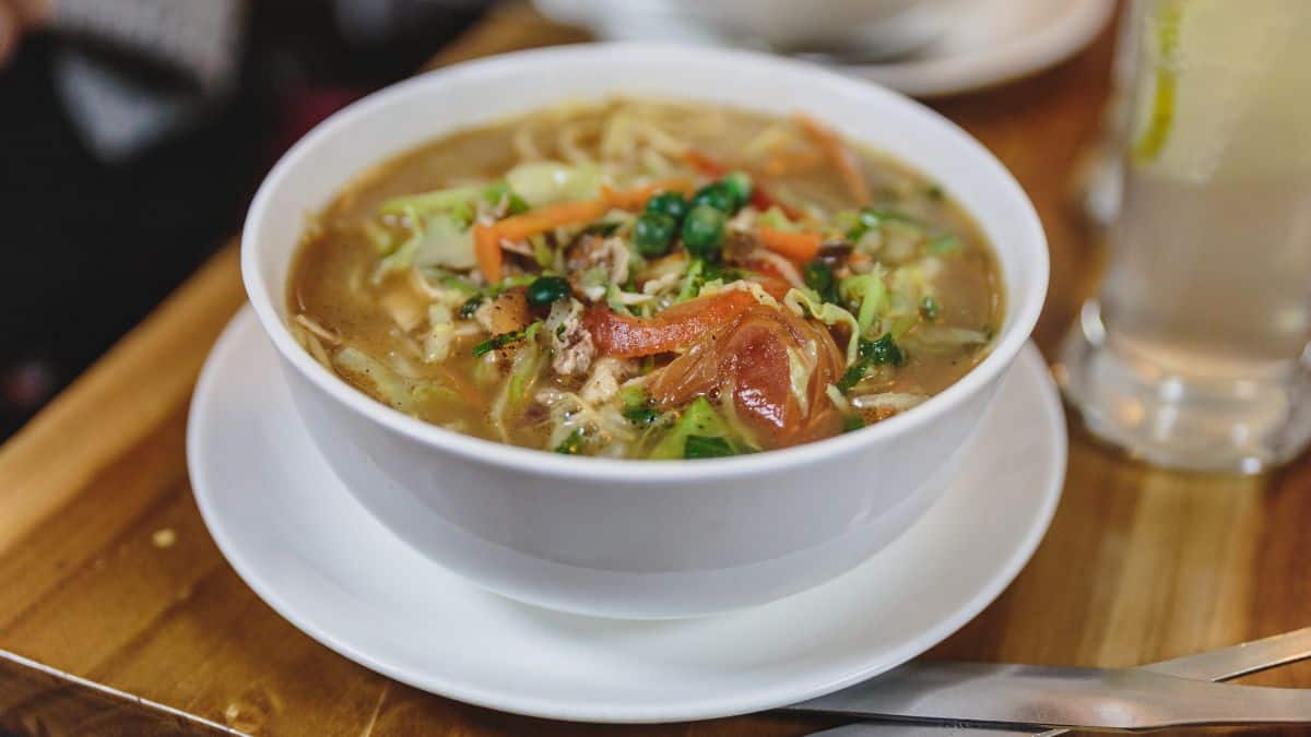 Thukpa soup in a white bowl.