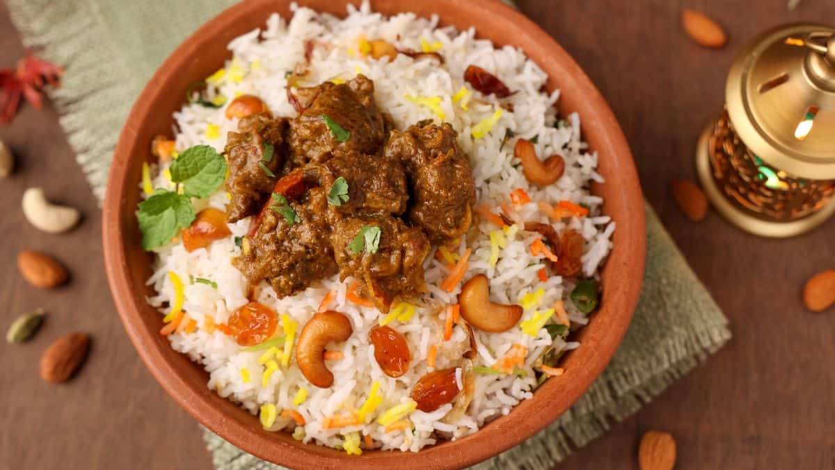 Palakkad prawn biryani in a clay pot.