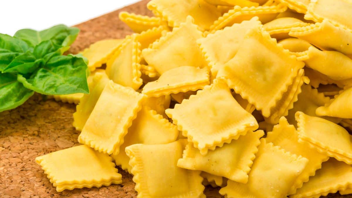 Ravioli on a wooden plate.