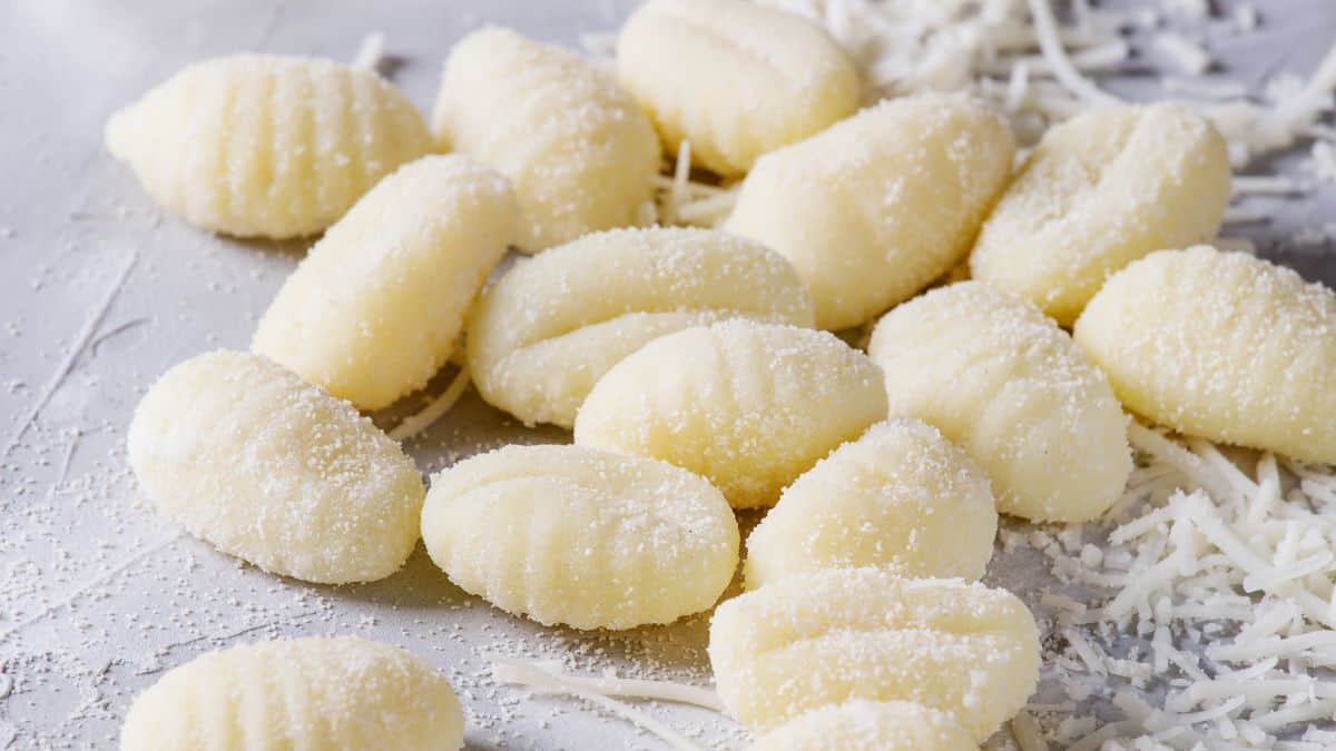 Fresh gnocchi on a board.