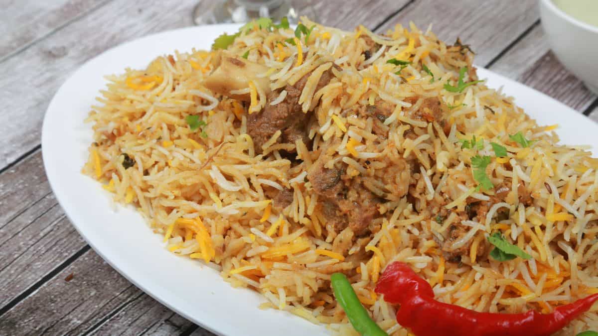 Iranian biryani on a wide white plate.