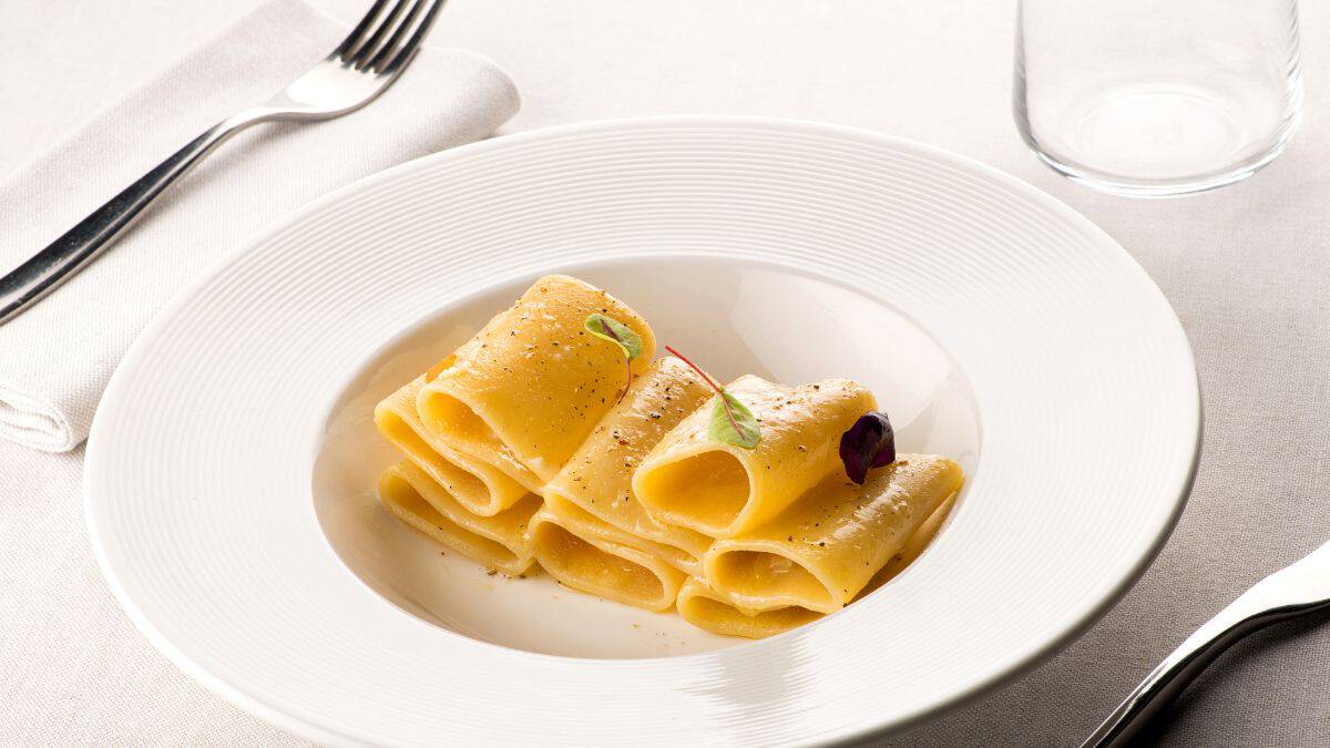 Paccheri pasta on a white plate.