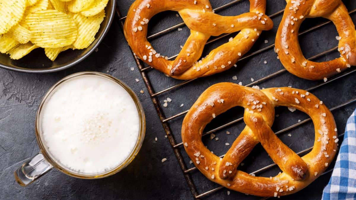 Pretzels on a brown board.