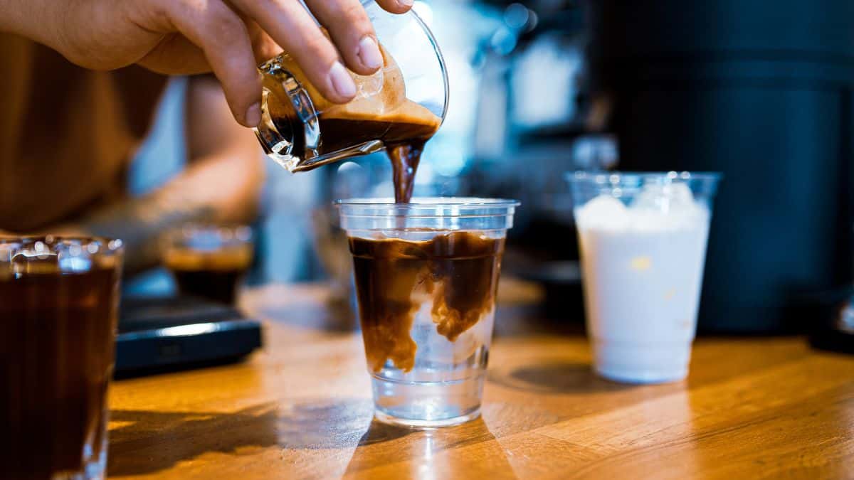 Barista making americano.