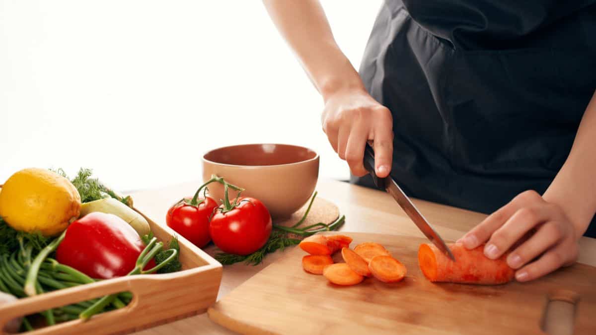 Man cutting vegetables.