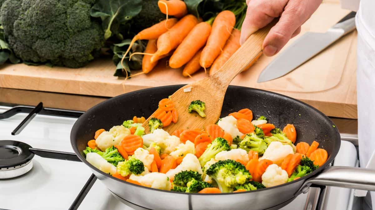 Sauted vegetables in a skillet.