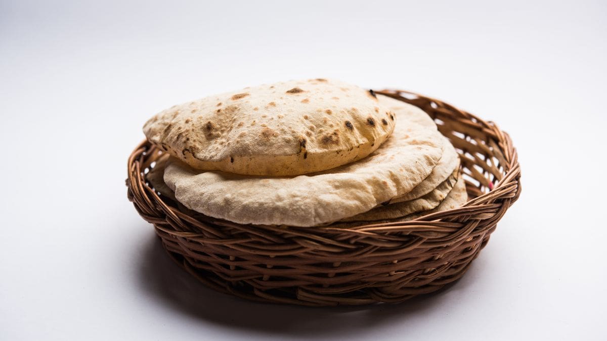 Fluffy roti in a bread basket.