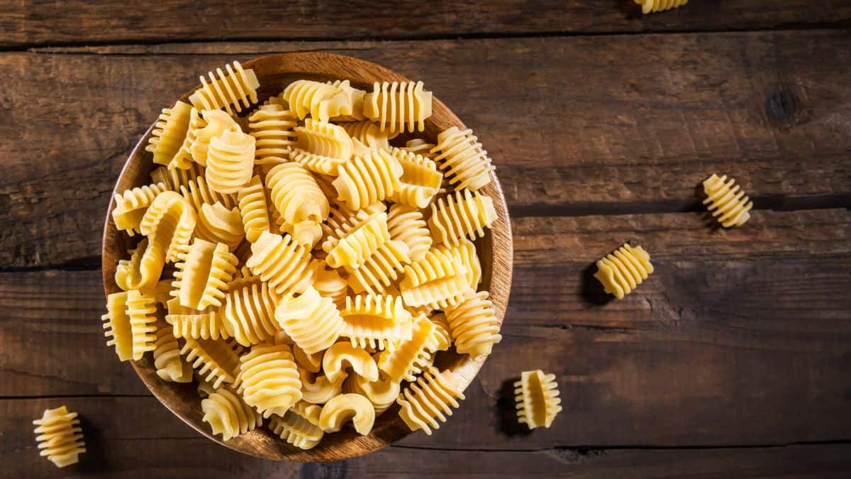 Radiatori pasta in a brown bowl.