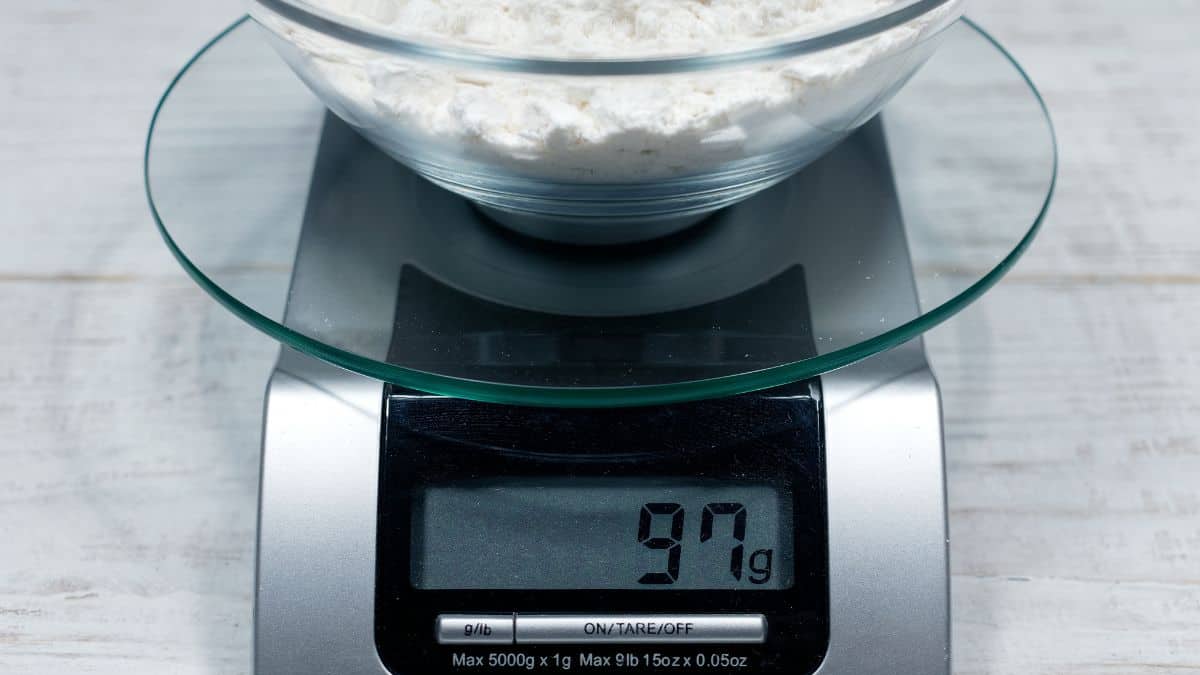 Digital weighing scale on a counter.