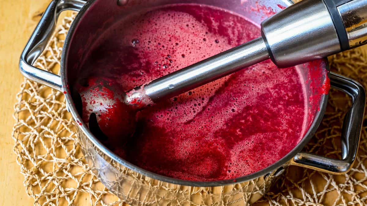 Immersion blender in a pot.