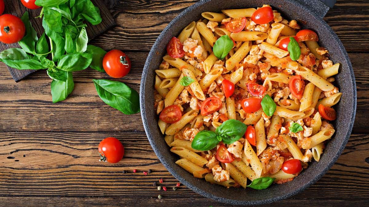 A bowl of penne pasta.