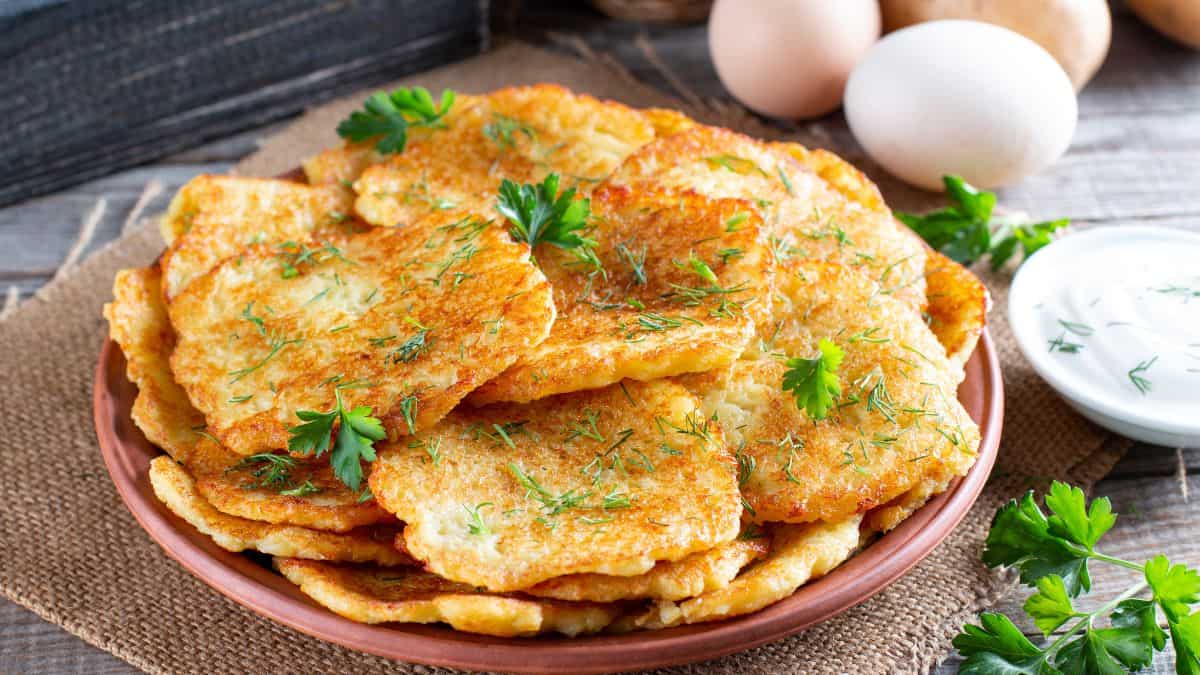 Potato cakes placed on a brown plate.