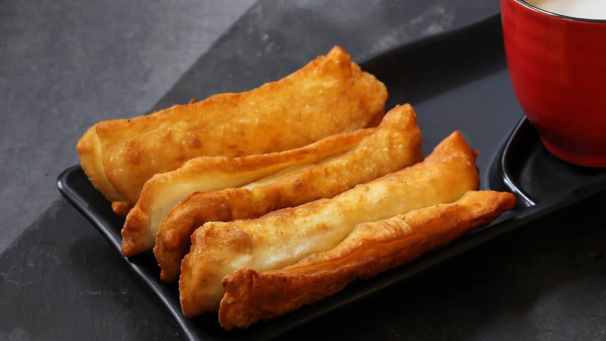 Youtiao on a black plate.