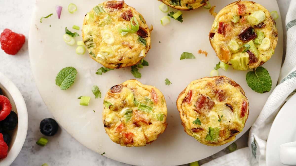 Small omlet bites on a white plate.