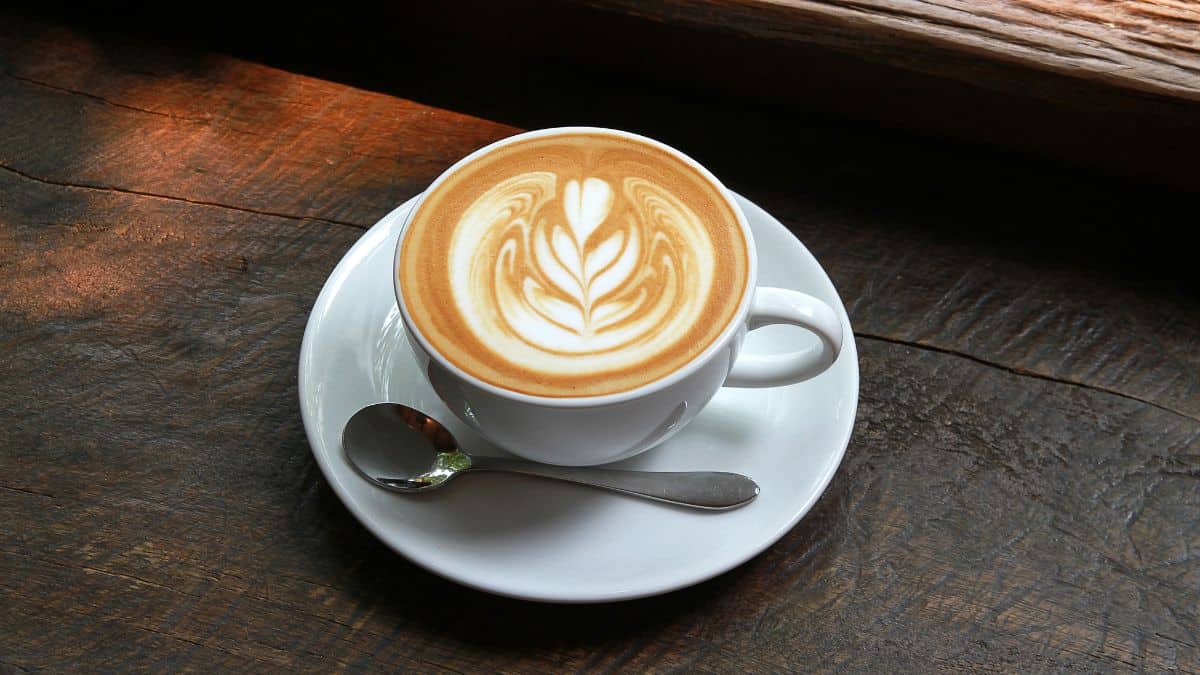 Latte cup on a table.