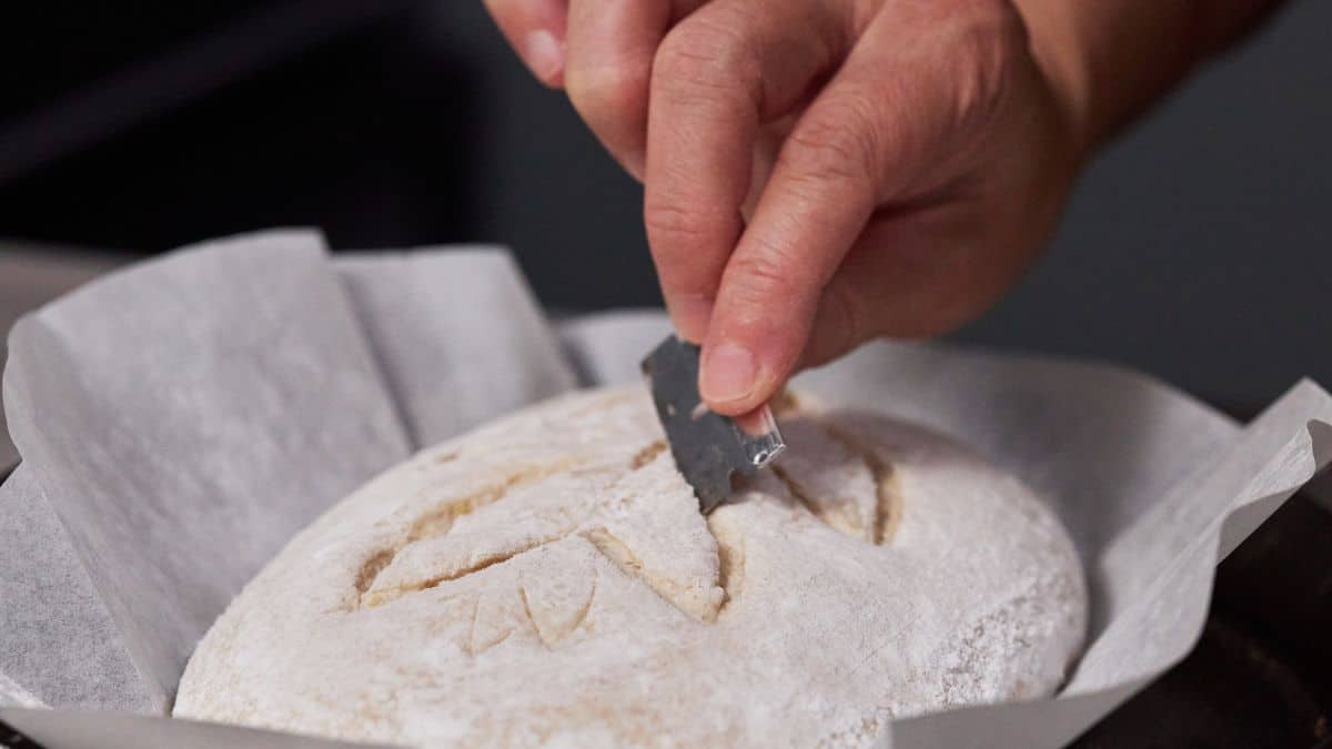 Scoring the bread dough.