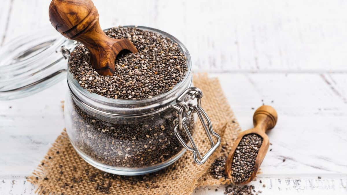 Chia seeds in a small glass jar.