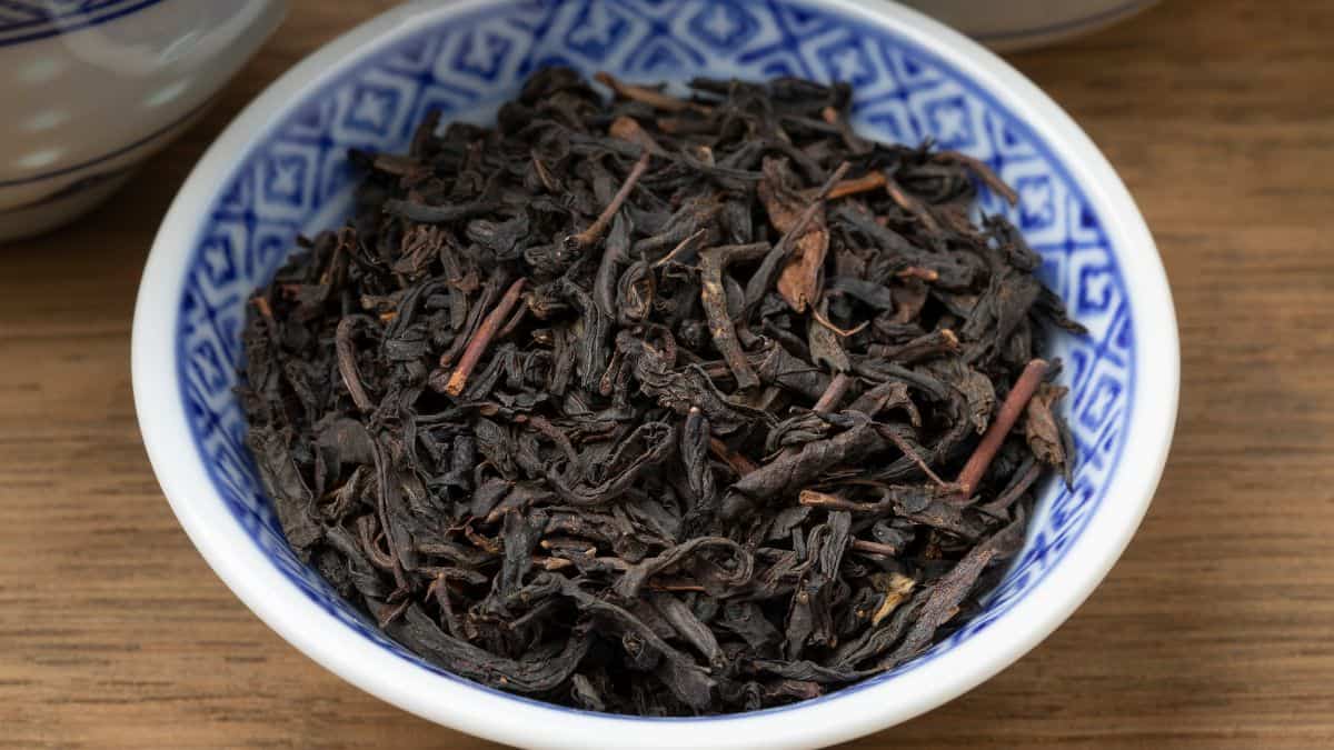 Chinese tea in a small blue bowl.