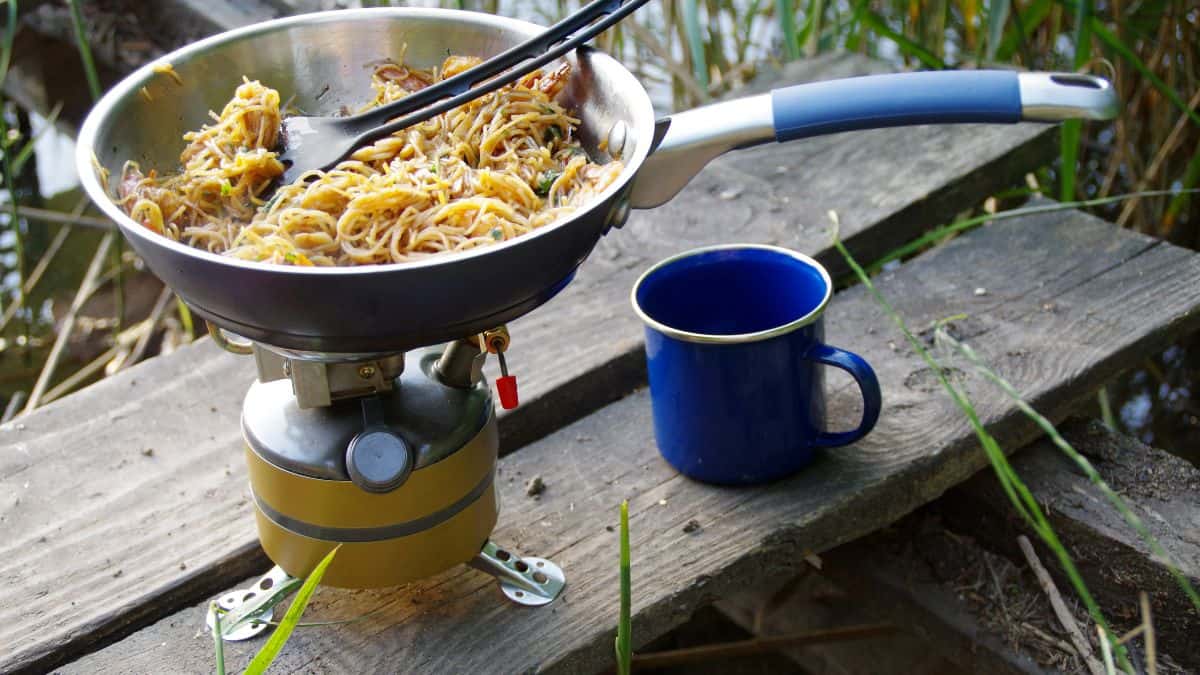 Cooking food on picnic stove.