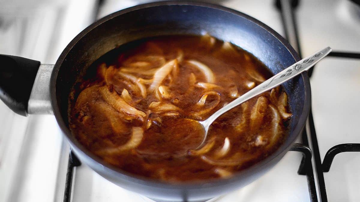 Onion gravy in a small frying pan.