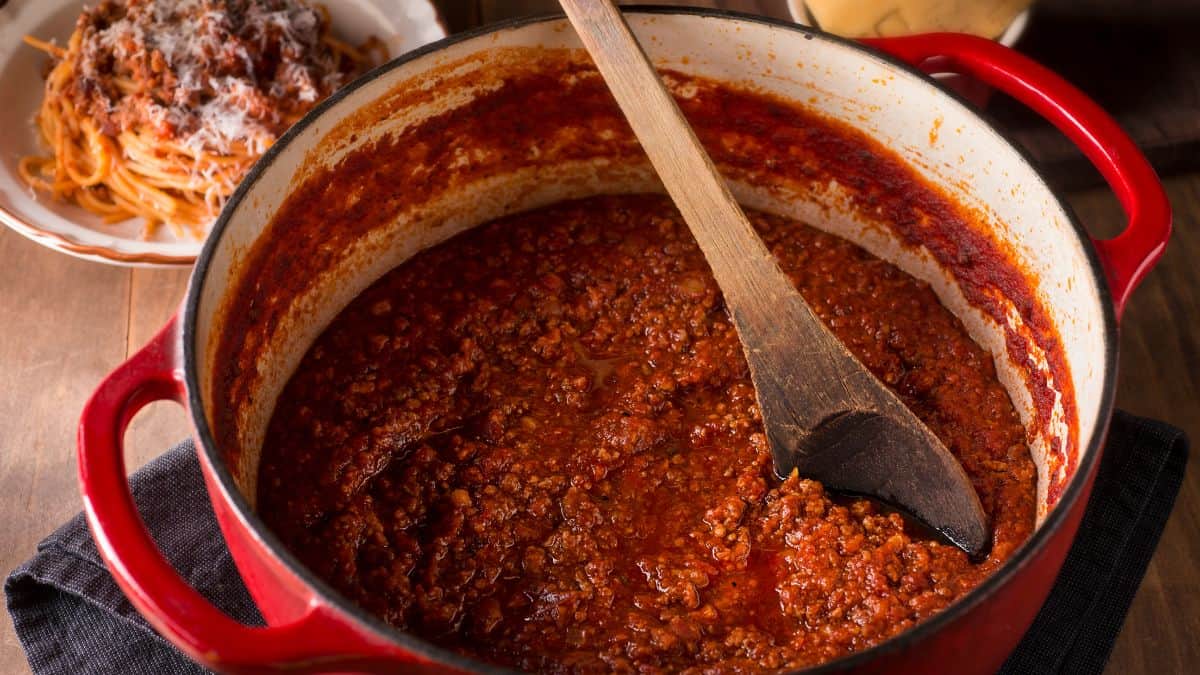 Bolognese sauce cooked in a Dutch oven.