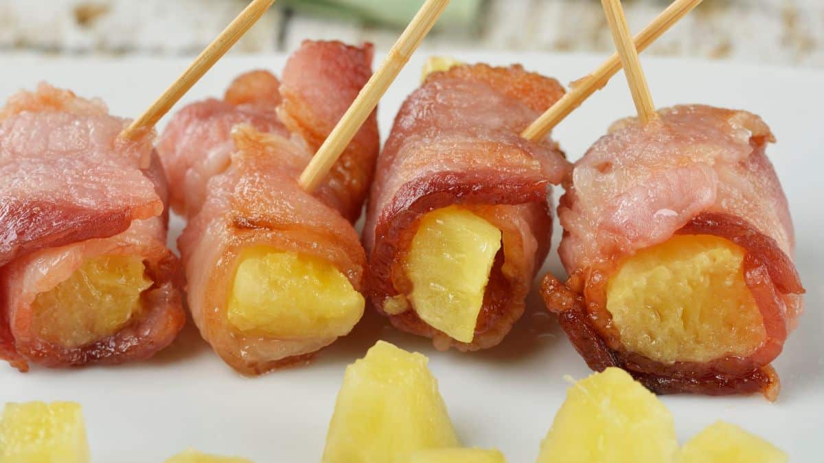 Bacon wrapped pineapple chunks.