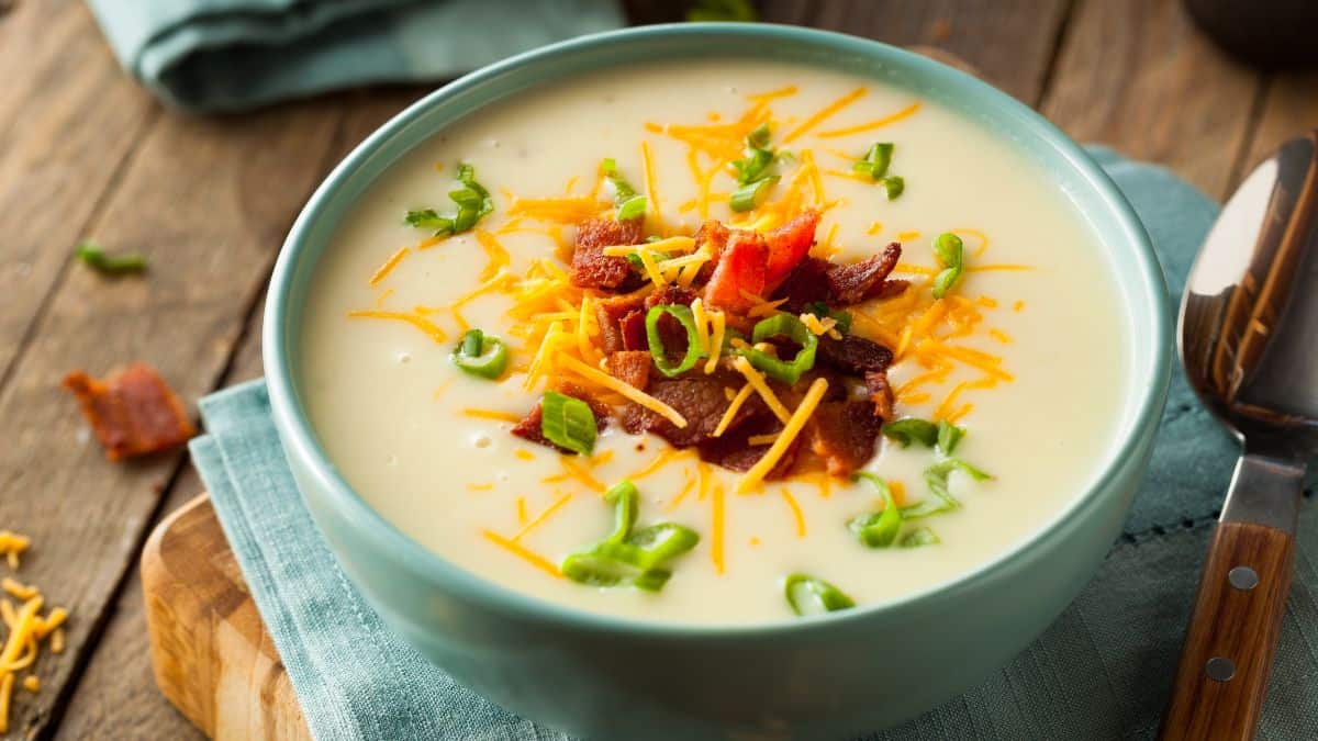 Vegetable soup in a green bowl.