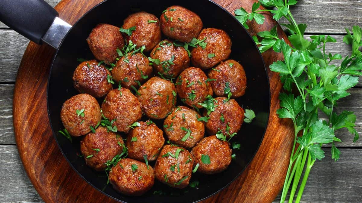 Meatballs in a skillet.