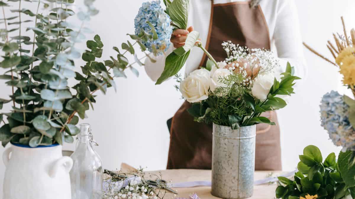 Woman arranging flowers.