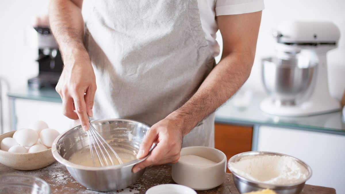 Mixing vanilla extract into cake batter.