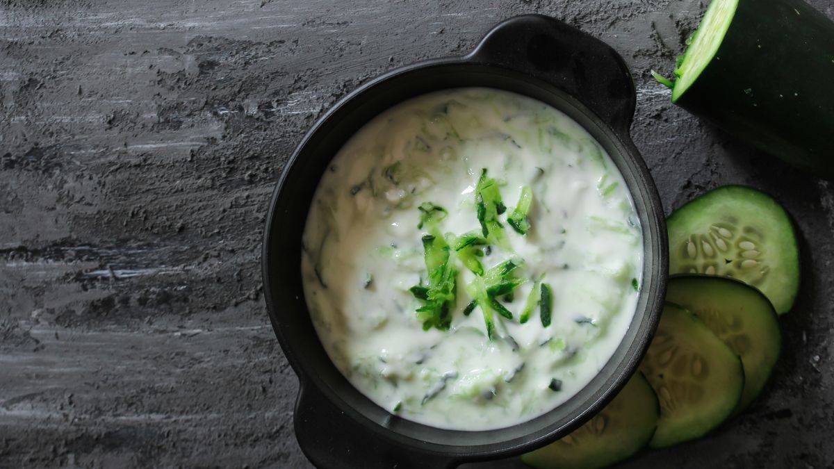 Yogurt dip in a black bowl.