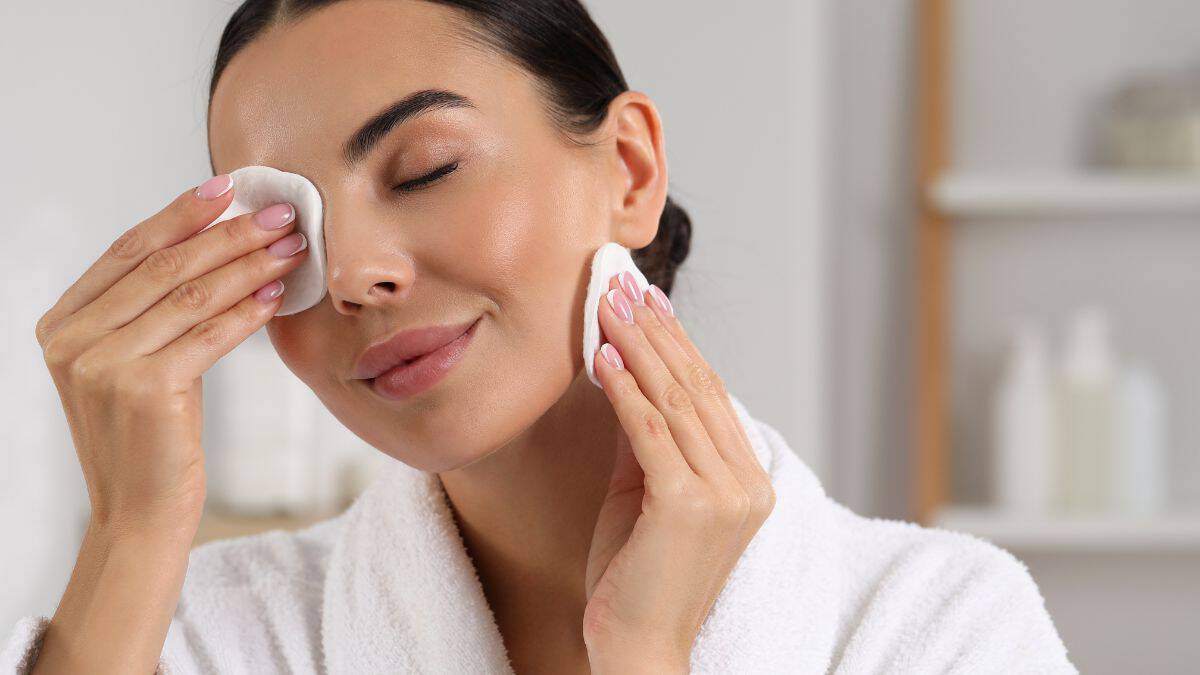 Woman removing makeup.