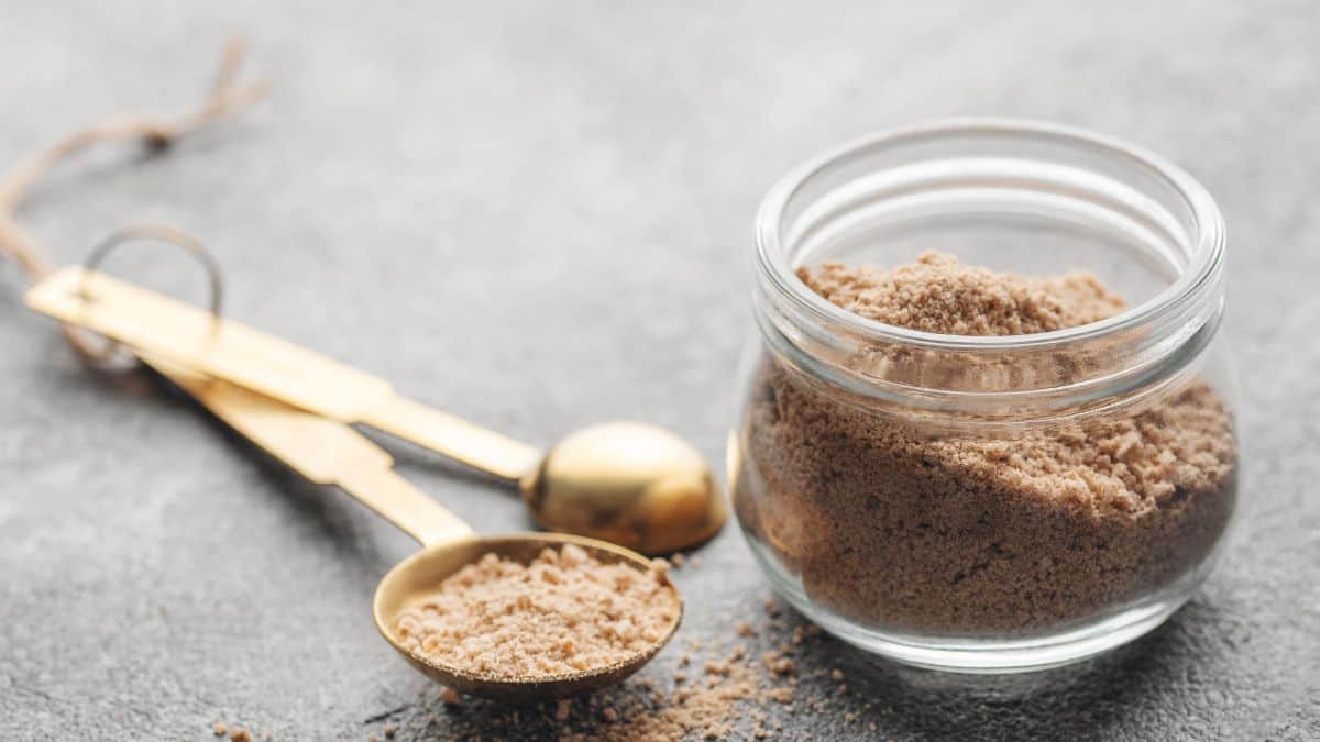 Hickory smoke powder in a small jar and spoon.