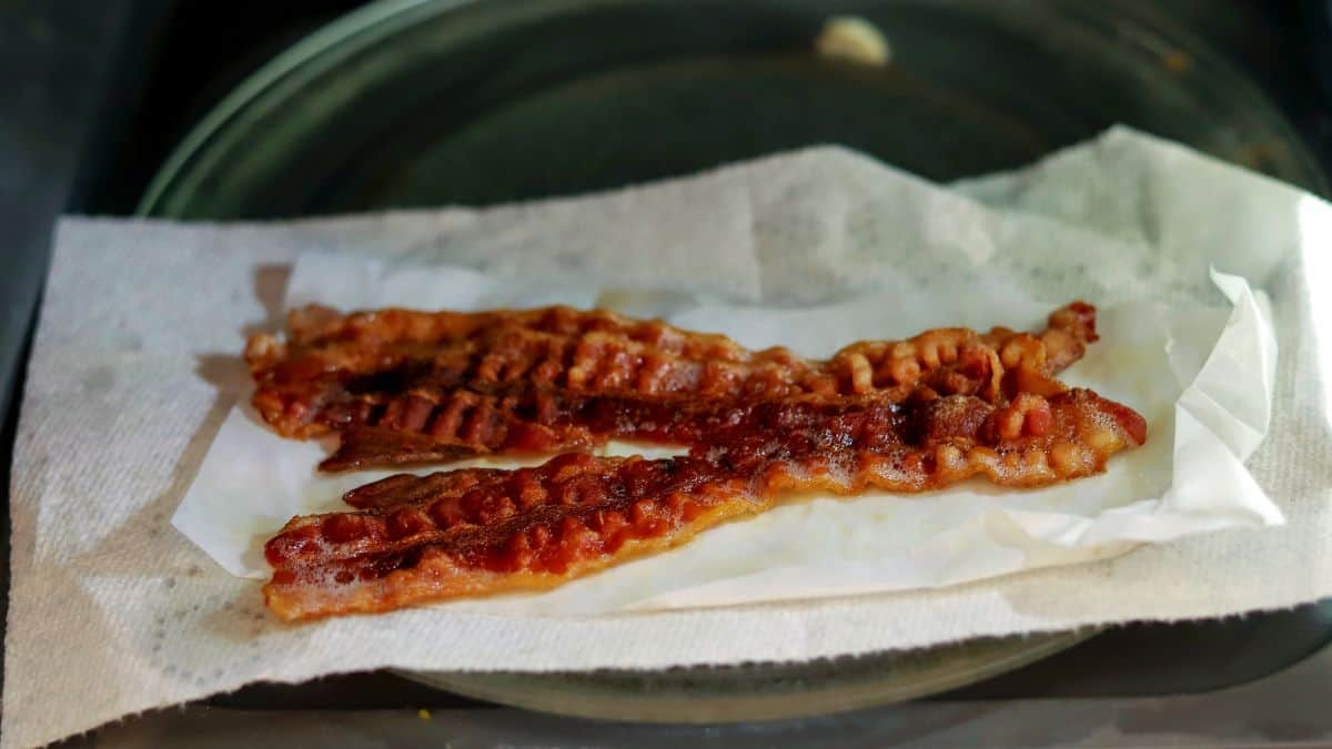 Bacon being cooked in a microwave.