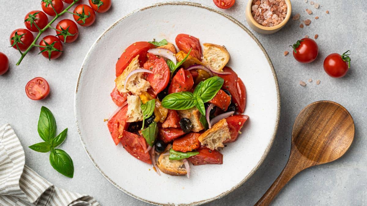 Panzanella salad in a white plate.