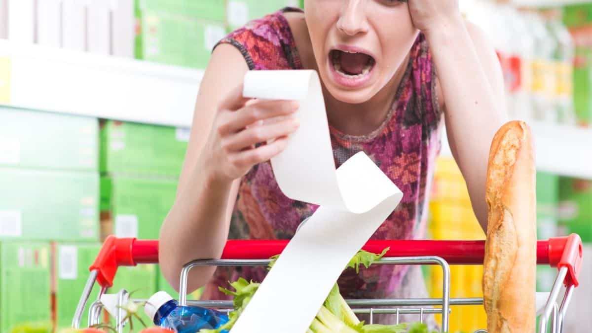 A woman with grocery bill.