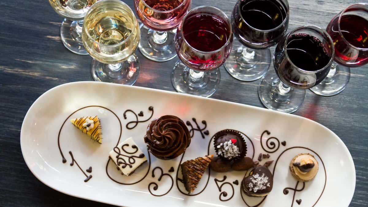 Dessert platter with wine glasses.