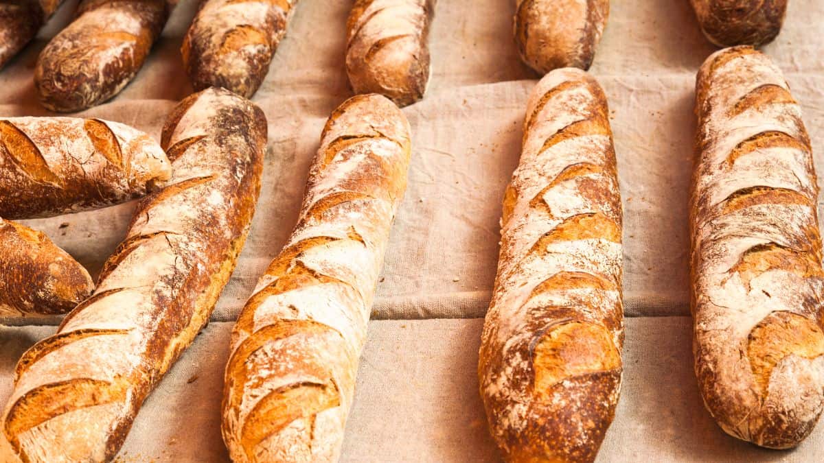 Baguette on wooden board.