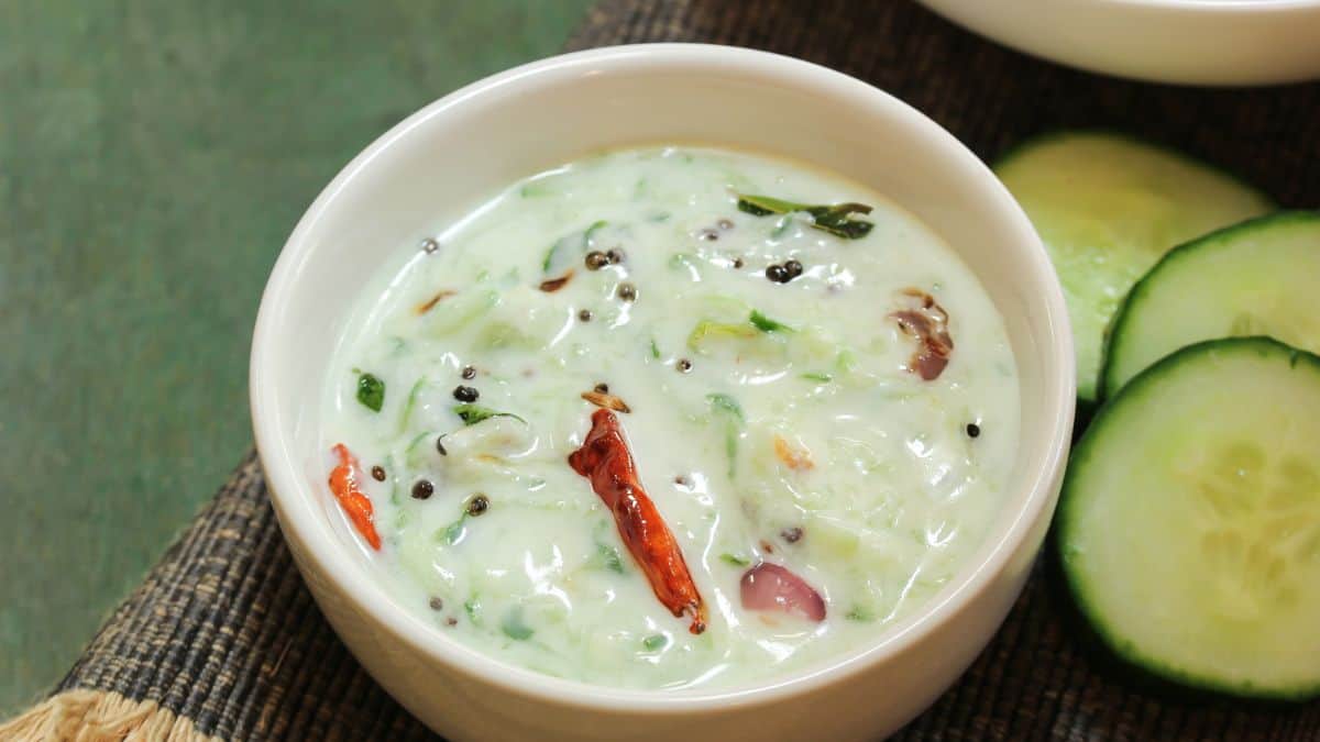 Raita in a white bowl.