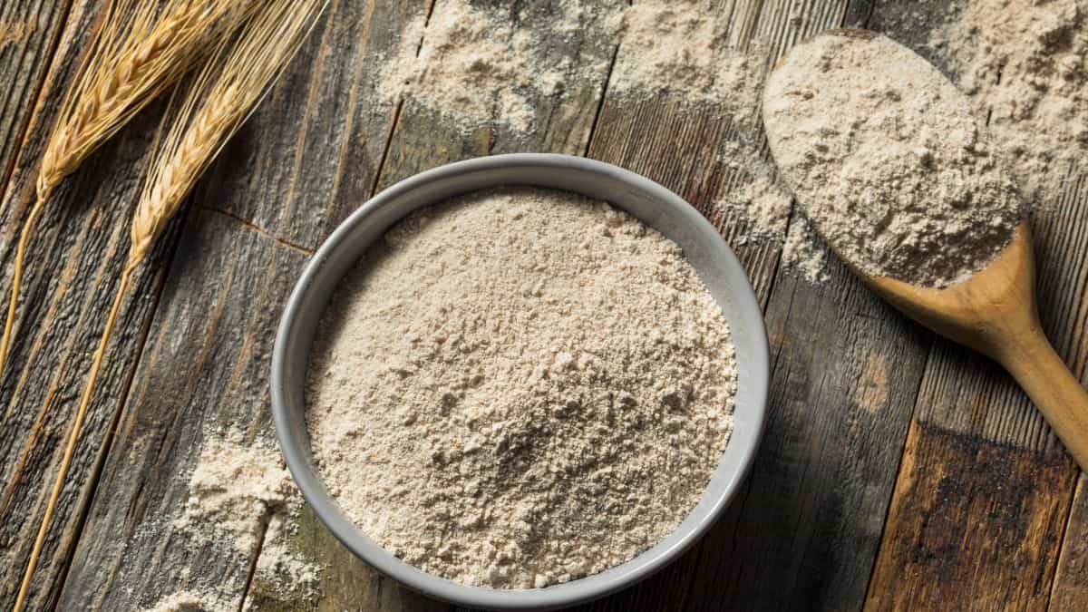 Whole wheat flour in a grey bowl.