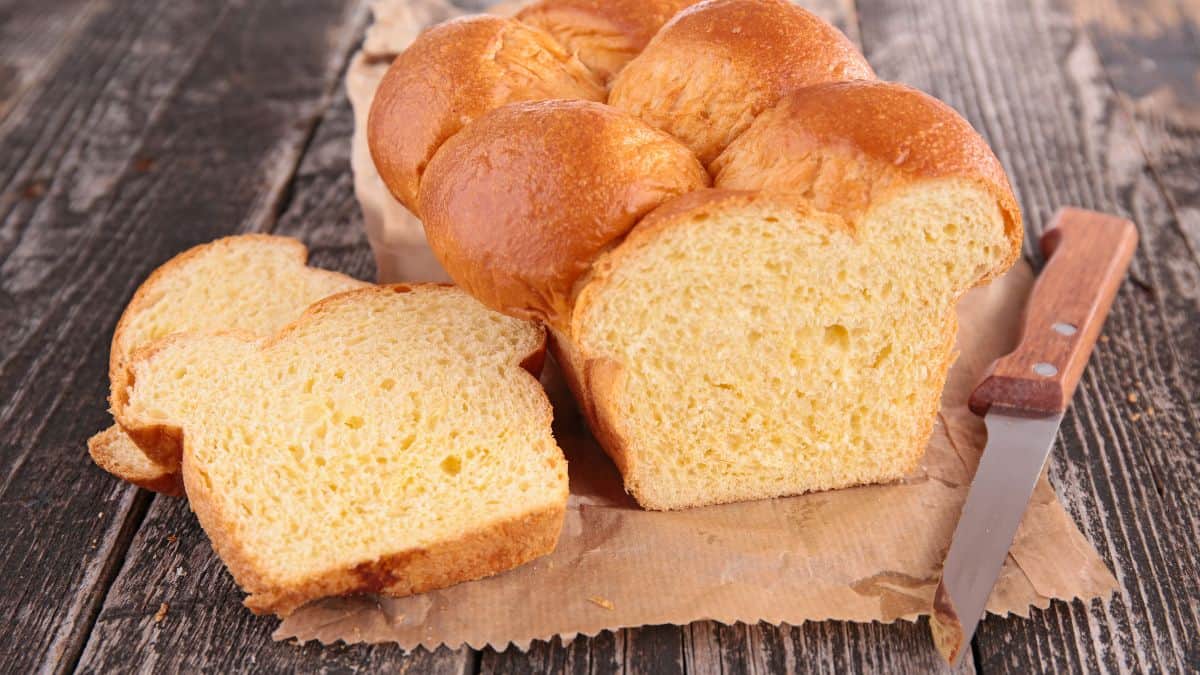 Sliced brioche bread on a board.