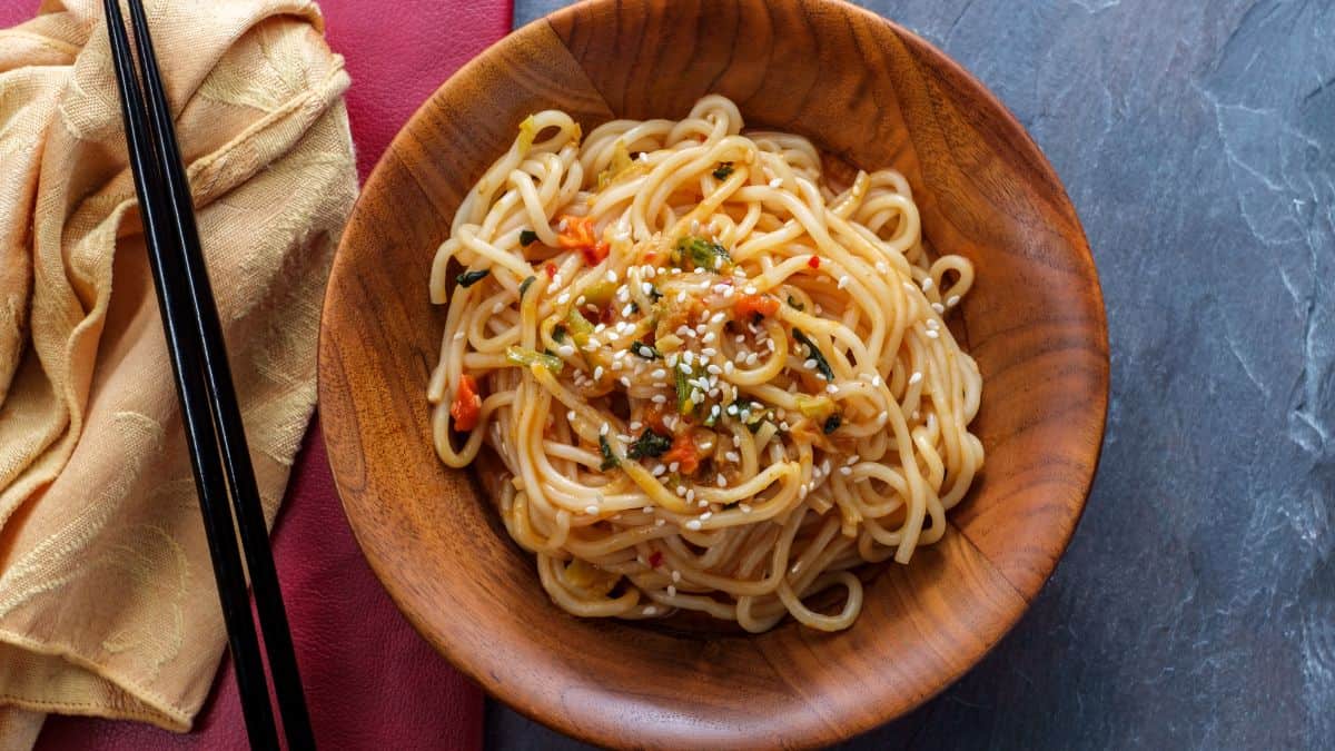 Lo mein in a brown bowl.