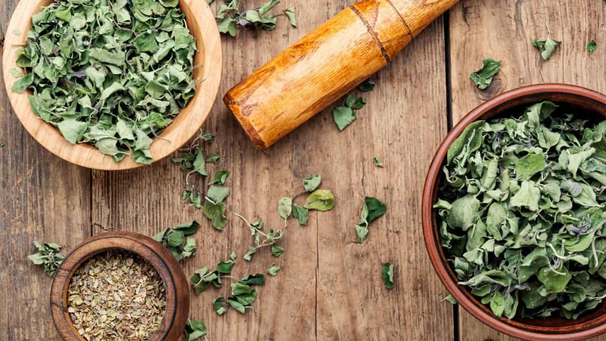 Dried herbs in a wooden bowl.