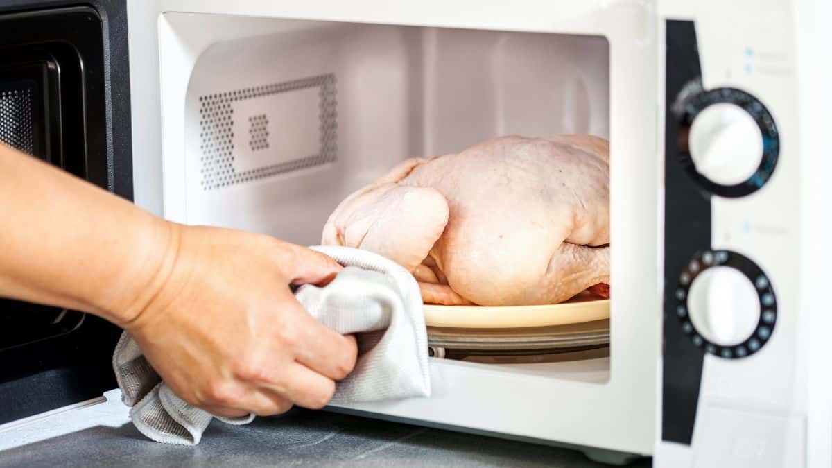 Frozen chicken in microwave.