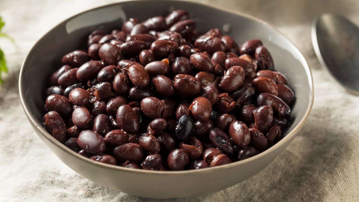 A bowl of cooked black beans.