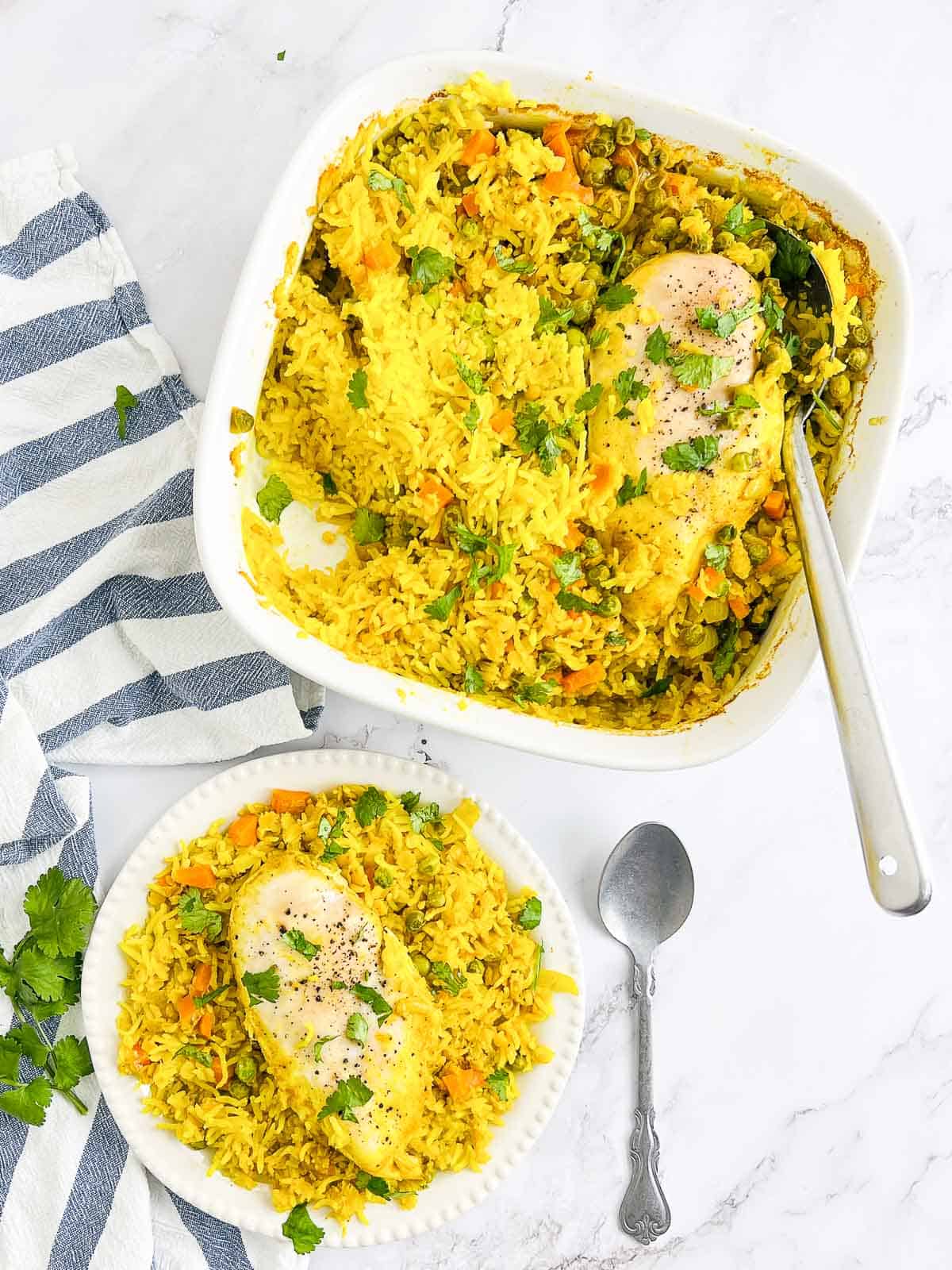 Tumeric rice casserole on plate and casserole dish.