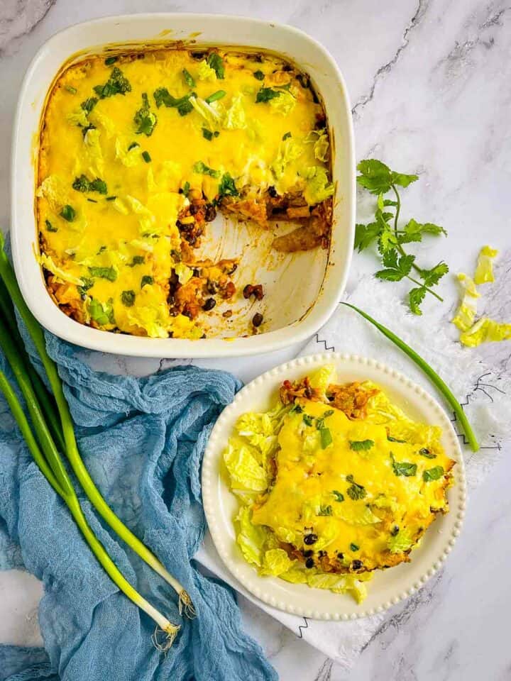 Walking taco casserole on a plate and in casserole dish.