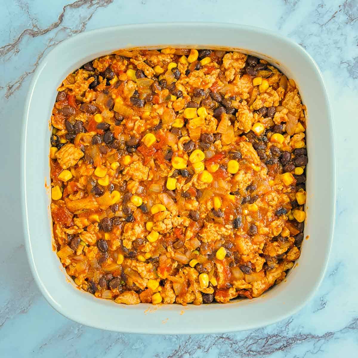 Chicken filling in the casserole dish.