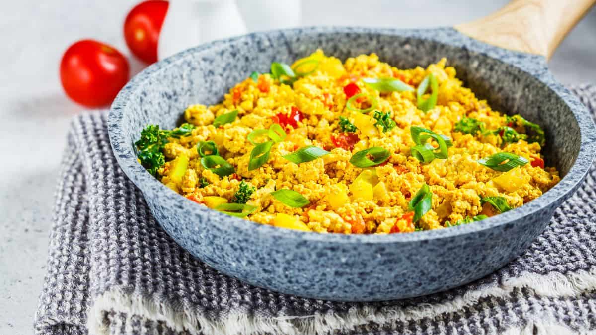 Tofu and veggie scramble in s skillet.