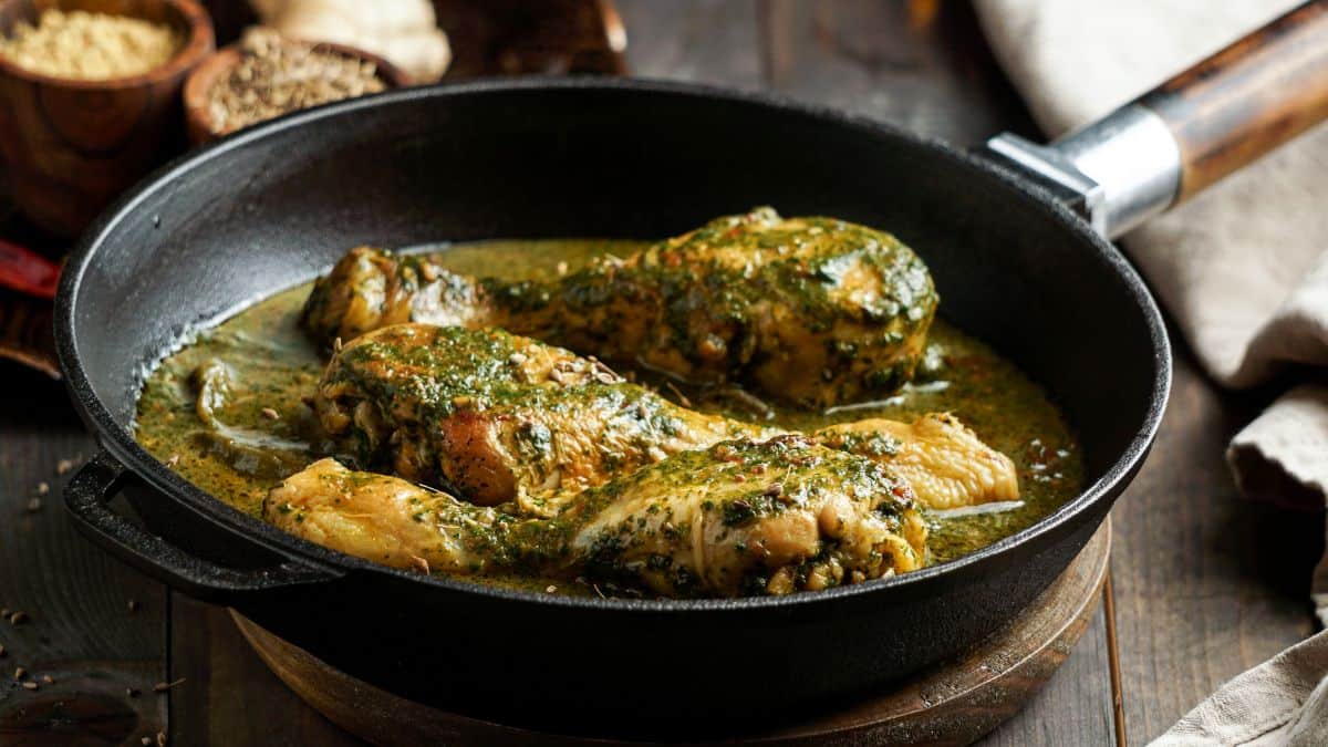 Trini chicken curry in a skillet.